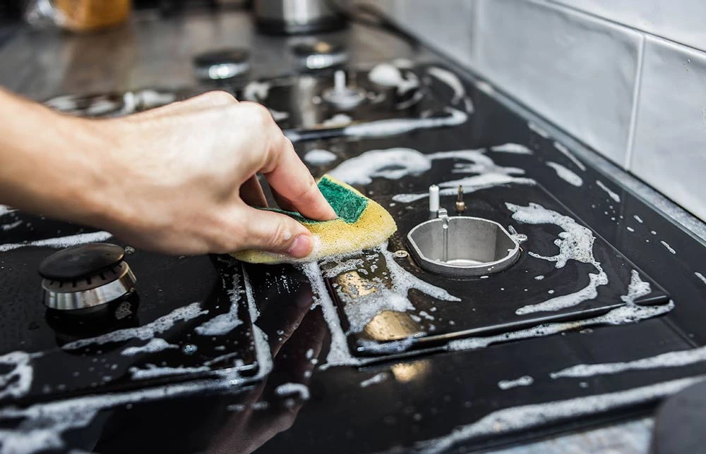 how to clean gas stove top